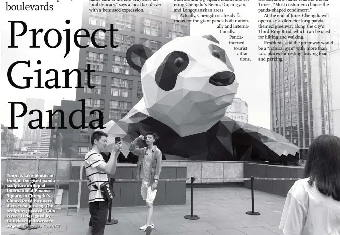  ?? Photo: Liu Caiyu/GT ?? Tourists take photos in front of the giant panda sculpture on top of Internatio­nal Finance Square, in Chengdu’s Chunxi Road business district on June 15. The sculpture, named “I Am Here,” is designed by British artist Lawrence Argent.