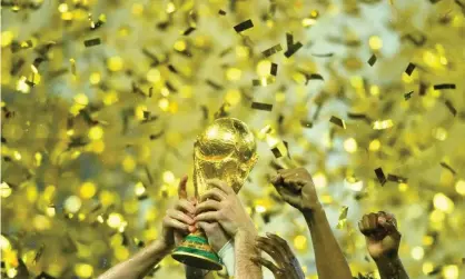  ?? Photograph: Dylan Martinez/Reuters ?? France celebrate with the World Cup after winning the final in 2018.