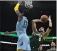  ?? STEVEN SENNE — AP ?? Boston's Jayson Tatum shoots over Memphis' Jaren Jackson Jr. during Sunday's game.