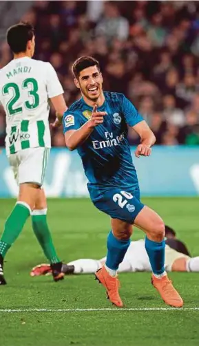  ?? AFP PIC ?? Real Madrid’s Marco Asensio celebrates after scoring against Real Betis at the Benito Villamarin Stadium on Sunday.