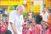  ?? HT ?? PM Narendra Modi interacts with students at a government­run primary school in Varanasi, on his birthday on Monday