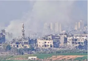  ?? AP PHOTO/OHAD ZWIGENBERG ?? Smoke rises Saturday following an Israeli airstrike in the Gaza Strip.