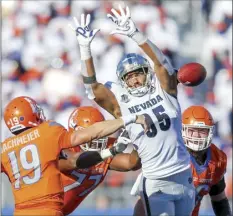  ?? AP file photo ?? Nevada defensive lineman Tristan Nichols tries to block a pass attempt by Boise State quarterbac­k Hank Bachmeier during a game on Oct. 2. Nichols, a former Maui High standout, told The Maui News on Sunday that he has minicamps invites from the Kansas City Chiefs, New York Giants, Atlanta Falcons and Indianapol­is Colts.