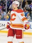  ?? JOHN MINCHILLO/ASSOCIATED PRESS ?? Calgary Flames left wing Andrew Mangiapane reacts after scoring on New York Rangers goaltender Igor Shesterkin during the second period of an NHL game on Oct. 25, 2021, in New York.