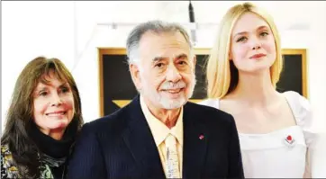  ?? AFP ?? Director Francis Ford Coppola (centre) poses with actresses Talia Shire (left) and Elle Fanning (right) as he receives a star on the Hollywood Walk of Fame in Hollywood, California on Monday.