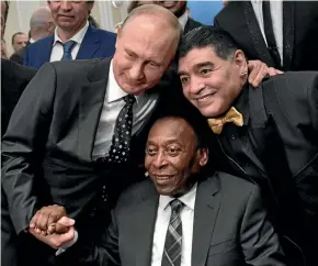  ?? AP ?? Russian President Vladimir Putin with World Cup legends Pele, centre, of Brazil, and Diego Maradona of Argentina.