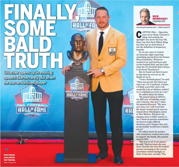  ?? GENE J. PUSKAR/AP ?? Brian Urlacher poses with his bust Saturday.