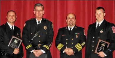  ?? CHARLES PRITCHARD — ONEIDA DAILY DISPATCH ?? Police Officer Matt Gacek, left, Police Chief Paul Thompson, Fire Chief Kevin Salerno and Fire Fighter Dennis Relyea at the Charlie Decker Public Safety Dinner on Friday, May 11, 2018.