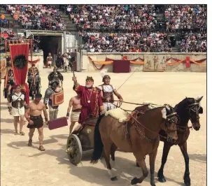  ??  ?? Emperor Hadrian arrives at the Great Roman Games in Nimes, France. While re-enactments of the gladiator tournament­s take place every April, the amphitheat­er itself hosts events and tours year-round.