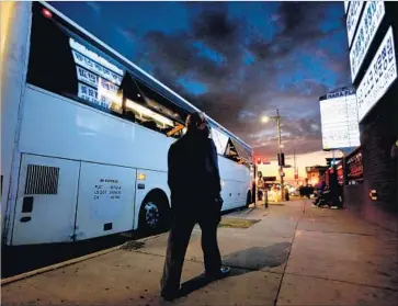  ?? Gary Coronado Los Angeles Times ?? A BUS bound for a casino waits for passengers along Olympic Boulevard in L.A. The federal agency that regulates buses and trucks has 1,140 workers to oversee 525,000 companies, relying largely on states for inspection­s.