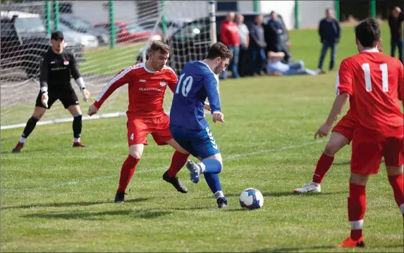  ??  ?? Jack Geraghty of Ashford Rovers shoots for goal against Monksland United.