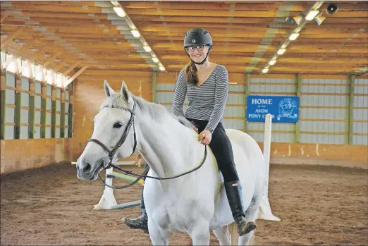  ?? COLIN CHISHOLM ?? Maddy Singer with her horse Brilliant at the Hants County Exhibition Grounds where they were getting ready for the Windsor Spring Horse Show from May 18 – May 21.