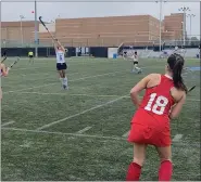  ?? MIKE CABREY/MEDIANEWS GROUP ?? North Penn’s Erin O’Donnell reaches up with her stick trying to get to a lifted ball by Souderton’s Lauren Frye during their game on Thursday.