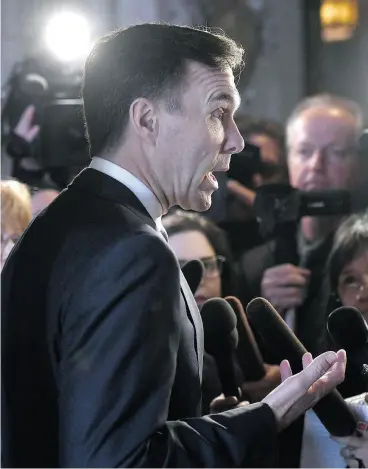  ?? JUSTIN TANG / THE CANADIAN PRESS ?? Finance Minister Bill Morneau speaks to reporters earlier this month. One of the predominan­t themes of next week’s federal budget will be increasing the work-force participat­ion of women, John Ivison writes.