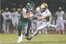  ?? OWEN WOYTOWICH ?? Running back Adam Machart is chasing Doug Rozon’s Huskies record for the most rushing yards (1,267) in a single season.