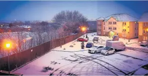  ??  ?? Winter scene The snow covers a car park at Bruce Avenue, Hamilton