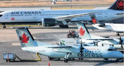  ?? REUTERS ?? Air Canada, whose airplanes are pictured here at Vancouver’s internatio­nal airport in Richmond, B.C. on Feb. 5, 2019, is among the big players making up a consortium with a mandate to deliver more COVID-19 testing to asymptomat­ic Canadians.