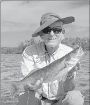  ?? Arkansas Democrat-Gazette/BRYAN HENDRICKS ?? Arkansas Democrat-Gazette outdoors writer Bryan Hendricks (left) caught his three biggest smallmouth bass ever last week at the Boundary Waters Canoe Area Wilderness in northern Minnesota. The biggest was close to 5 pounds. Also making the trip was...