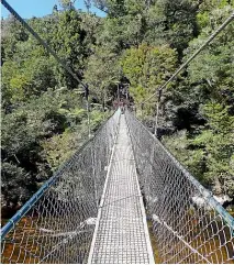  ??  ?? A 47-metre swing bridge across Falls River provides some wobbly fun.