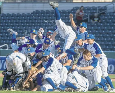  ?? Steph Chambers/Post-Gazette ?? 12. Canon-McMillan baseball team celebrates its PIAA title.