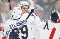  ?? Graham Hughes ?? The Associated Press Maple Leafs forward Auston Matthews celebrates with forward William Nylander (29) after scoring against the Montreal Canadiens in overtime of Toronto’s 4-3 victory Saturday in Montreal.