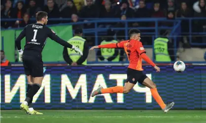  ?? Photograph: Oleksandr Osipov/Reuters ?? Taison lashes the ball at the Dynamo supporters