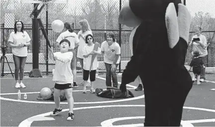  ?? KIM HAIRSTON/BALTIMORE SUN ?? Seven-year-old Ian Kay of Rodgers Forge hits a pitch from the Oriole Bird during a baseball clinic at Mt. Washington Pediatric Hospital.