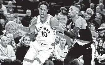  ?? AP PHOTO/STEVE DYKES ?? DRIVE. Toronto Raptors guard DeMar DeRozan drives to the basket on Portland Trail Blazers guard Damian Lillard during the first quarter of an NBA basketball game in Portland, Ore., Monday, Oct. 30, 2017.