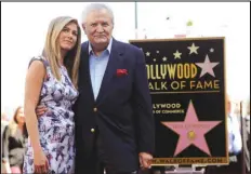  ?? CHRIS PIZZELLO/AP PHOTO ?? Actress Jennifer Aniston (left) poses with her father, actor John Aniston, on Feb. 23, 2012, after she received a star on the Hollywood Walk of Fame in Los Angeles.