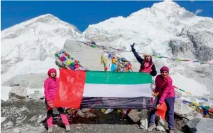  ?? Supplied photo ?? Suha Abdullah Alkhamayse­h, Rana Abdullah Theeb and Rasha Mohd Ezzat Badawi raise the UAE flag at the Mt Everest Base Camp as a tribute to the late Sheikh Zayed. —