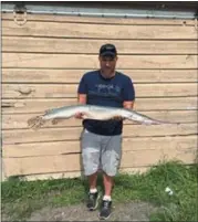  ?? PHOTO PROVIDED. ?? Michael Gatus, of Hoosick Falls, with the 14lb. 10 oz. longnose gar he caught from Lake Champlain, Washington County on August 18, 2018.