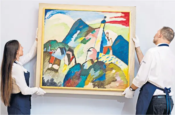  ?? ?? Murnau mit Kirche II, above, was extorted from Johanna Stern, pictured below with her children, by the Nazis. The Kandinsky painting had hung in the dining room at the family’s home in Berlin, below right