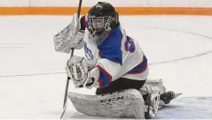  ?? Dave Stewart/Hearst Connecticu­t Media ?? West Haven/SHA goalie Belle Desrosiers grabs the puck in the air during a girls ice hockey game against the Avon co-op at Bennett Rink in West Haven on Jan. 7.