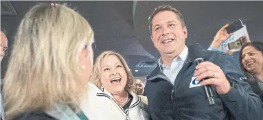  ?? JONATHAN HAYWARD THE CANADIAN PRESS FILE PHOTO ?? Stella Ambler, centre left, campaigns with former Conservati­ve leader Andrew Scheer in Mississaug­a in 2019. Ambler’s legal team argued it was “unlawful” for Premier Doug Ford to appoint another candidate over her for the 2022 election.
