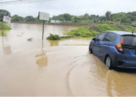  ?? (Photo: Naphtali Junior) ?? Flooding in a section of Big Pond, St Catherine, following the passage of Tropical Storm Ida in August.