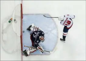  ?? THE ASSOCIATED PRESS ?? Washington Capitals’ Chandler Stephenson, right, scores against Columbus Blue Jackets’ Sergei Bobrovsky, of Russia, during the third period of Game 6 of an NHL first-round hockey playoff series Monday, April 23, 2018, in Columbus, Ohio. The Capitals...