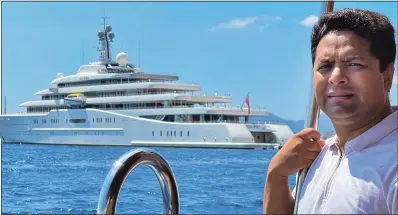  ?? ?? ALL AT SEA: Reporter Abul Taher in front of Roman Abramovich’s Eclipse yacht, anchored two miles from shore