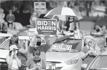  ?? JOHNRAOUX/AP ?? Supporters cheer as formerPres­ident BarackObam­aspeaks at a rallyTuesd­ay in Orlando.