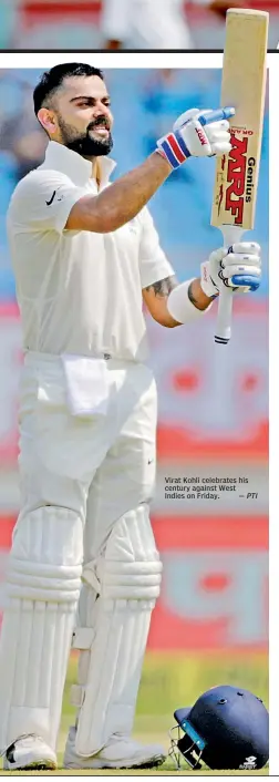  ?? — PTI ?? Virat Kohli celebrates his century against West Indies on Friday.