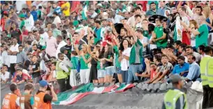  ??  ?? Balloons being released before the start of the U-17 World Cup final between Mexico and Nigeria; and fans enjoying the final at the Mohammad bin Zayed Stadium in Abu Dhabi.