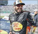  ?? COLIN E.BRALEY/AP ?? Cup points leader Martin Truex Jr. and Furniture Row Racing team members have faced many personal difficulti­es through this season.