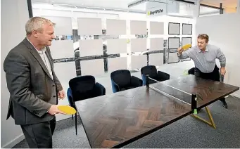  ?? ANDY JACKSON/STUFF ?? Carey Simonson and Paul Kyle play some table tennis at the Ray White New Plymouth office.