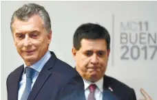  ?? AFPPIX ?? Argentinia­n President Mauricio Macri (left) and his Paraguayan counterpar­t Horacio Cartes arrive to attend the opening ceremony of the 11th Ministeria­l Conference of the World Trade Organisati­on in Buenos Aires on Sunday.