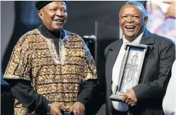  ?? / SIMPHIWE NKWALI ?? Jonas Ngwangwa and Hugh Masekela share a joke during the Joy of Jazz festival in Newtown.