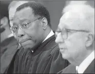  ?? Arkansas Democrat-Gazette/STATON BREIDENTHA­L ?? Judge Lavenski Smith (left) listens as Judge Morris Arnold speaks during a ceremony Friday in Little Rock honoring Smith and his appointmen­t as chief judge of the 8th U.S. Circuit Court of Appeals.