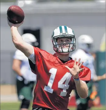  ?? Mark Lennihan Associated Press ?? ROOKIE SAM DARNOLD will be competing with veteran quarterbac­ks Josh McCown and Teddy Bridgewate­r when the New York Jets open training camp this week at Rutgers University.