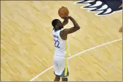  ?? BRANDON DILL — THE ASSOCIATED PRESS ?? Golden State Warriors forward Andrew Wiggins (22) shoots the ball in the second half Friday against the Memphis Grizzlies in Memphis, Tenn.