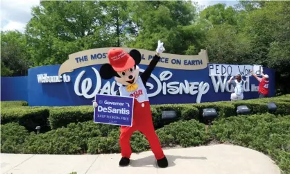  ?? Photograph: Octavio Jones/Reuters ?? Supporters of Florida's Republican-backed ‘don't say gay’ bill gather outside Walt Disney World in Orlando, on 16 April.