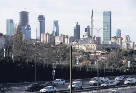  ??  ?? The business and financial district of Levent, home to leading Turkish banks’ and companies’ headquarte­rs, is seen behind a residentia­l neighborho­od in Istanbul, Turkey, Nov. 30, 2017.