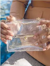  ?? DREAMSTIME ?? Several college and NFL football leagues have required patrons to use clear plastic “purses” for years.